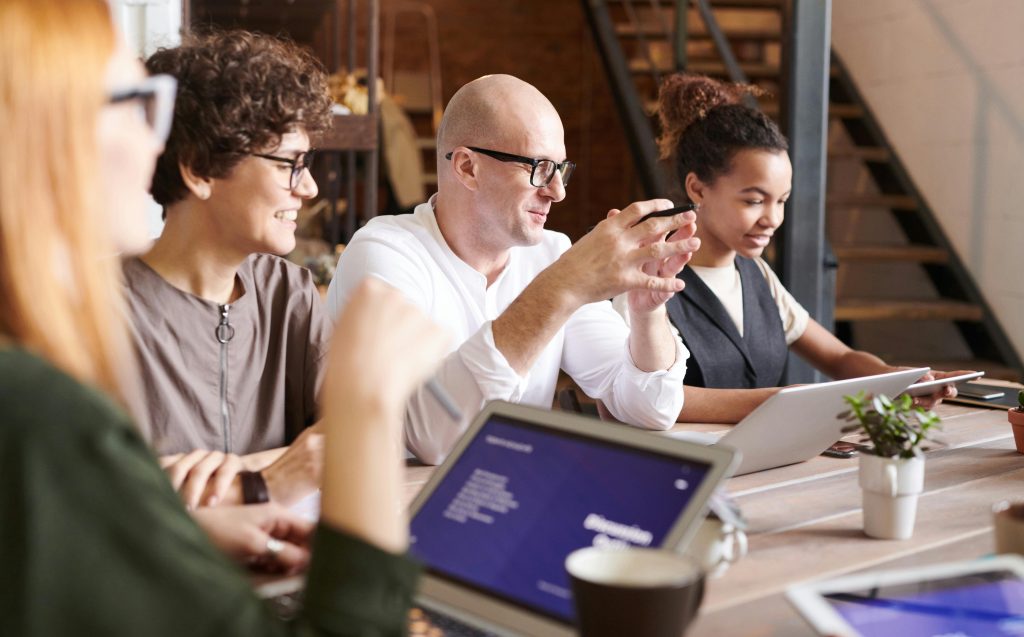 A diverse group of professionals engaging in a collaborative brainstorming meeting.